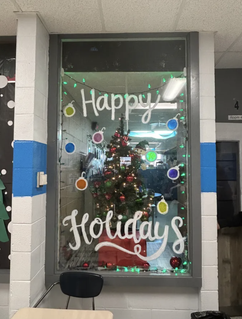 photo of easterseals "happy holidays" painted on school glass window